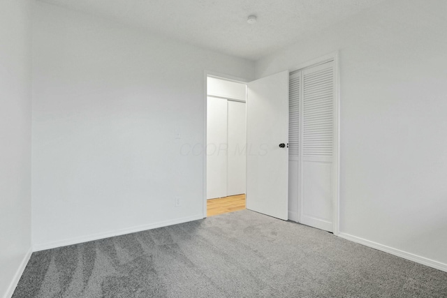 unfurnished bedroom featuring carpet