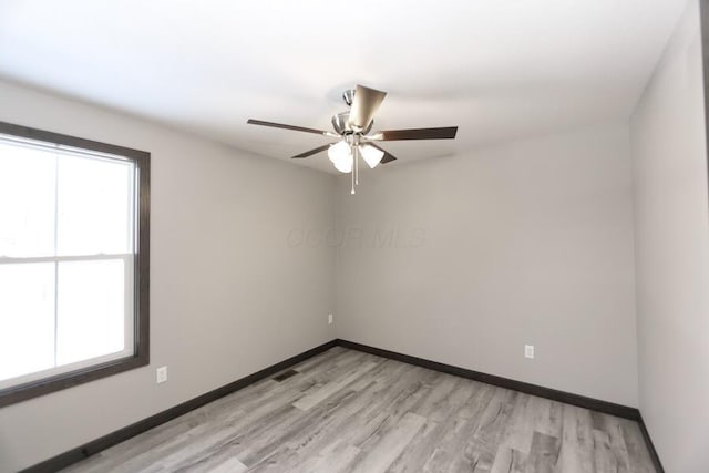 unfurnished room with ceiling fan and light hardwood / wood-style floors