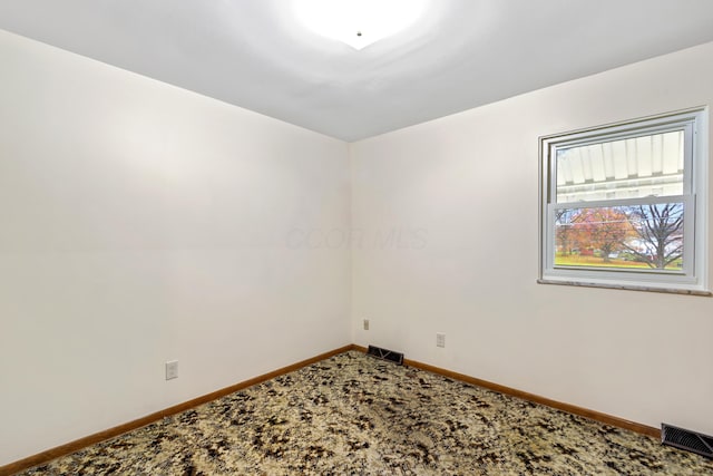 unfurnished room with carpet