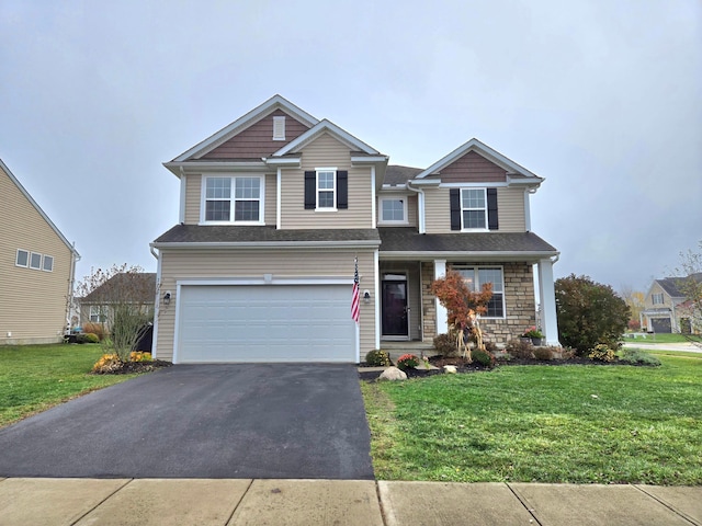 view of front facade featuring a front lawn and a garage