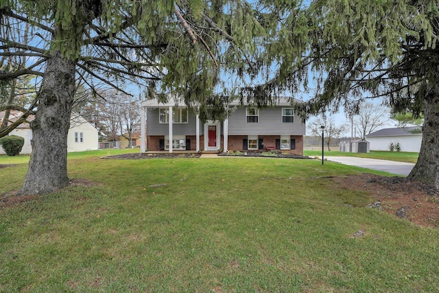 raised ranch with a front yard