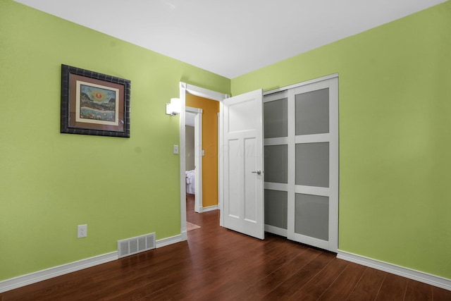 empty room featuring dark hardwood / wood-style floors