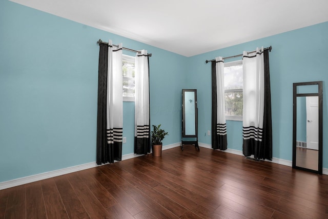 empty room featuring dark hardwood / wood-style floors