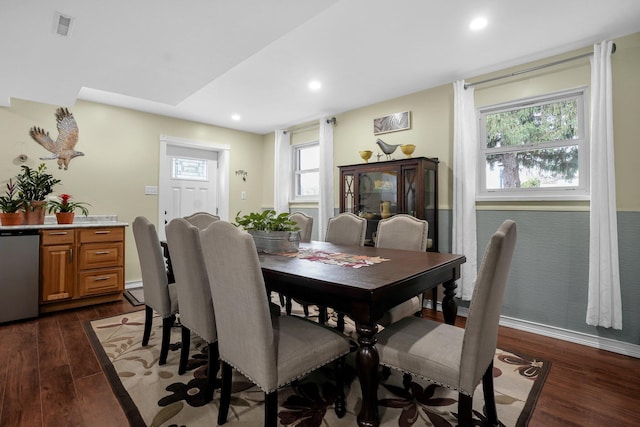 dining space with dark hardwood / wood-style floors