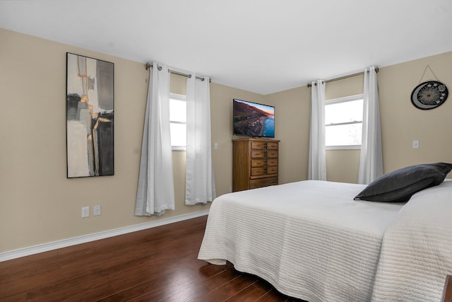 bedroom featuring dark wood-type flooring