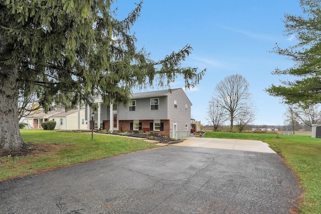 bi-level home with a front yard