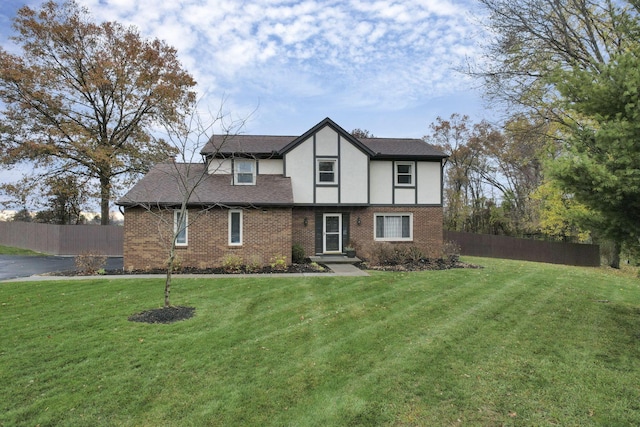 tudor house with a front lawn