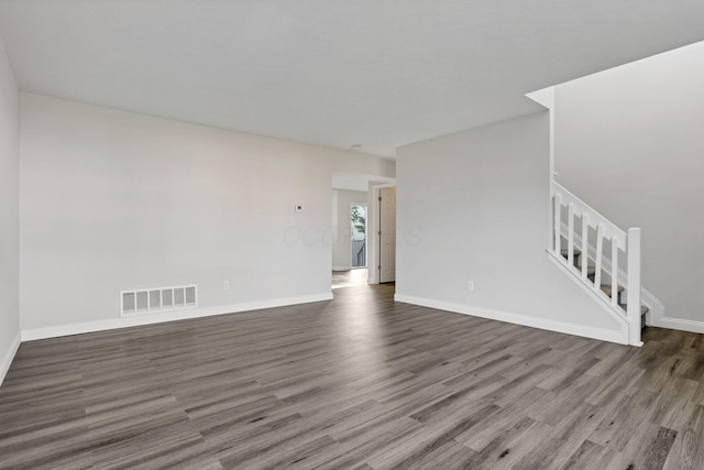 spare room with dark hardwood / wood-style flooring