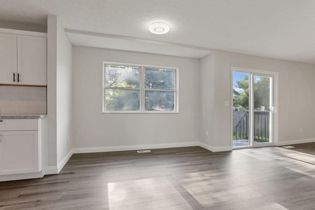 interior space featuring light hardwood / wood-style floors and a textured ceiling