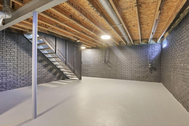 basement with brick wall