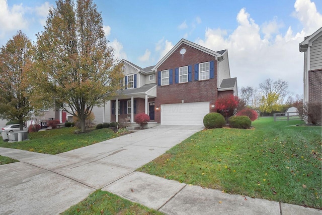 view of front of property featuring a front lawn and a garage