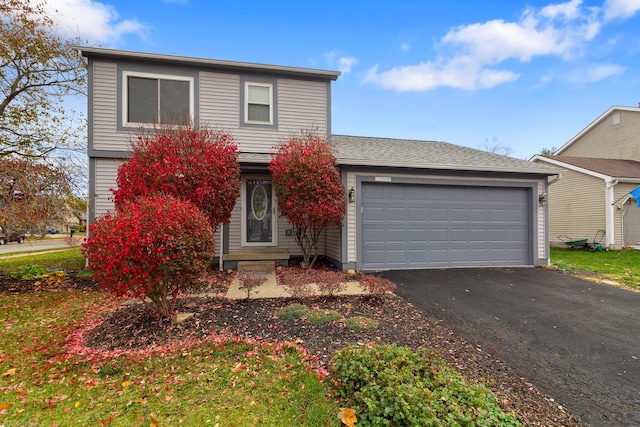 front of property with a garage