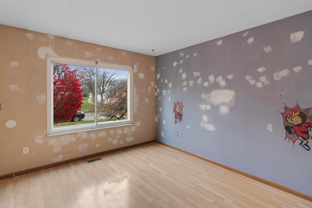 unfurnished room featuring light hardwood / wood-style flooring