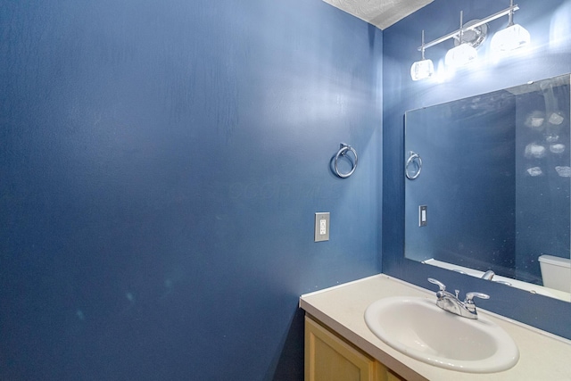 bathroom featuring vanity and a textured ceiling