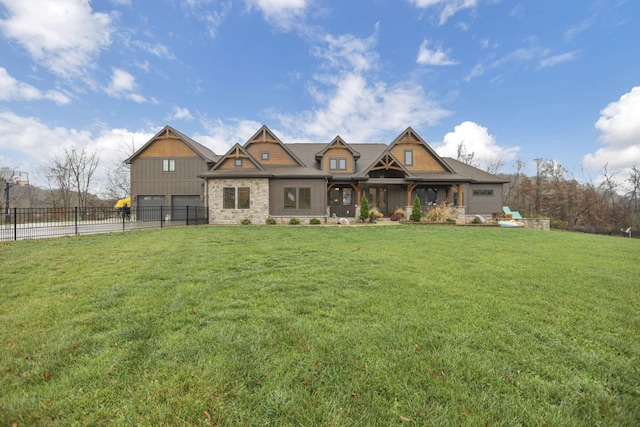 craftsman inspired home with a front lawn