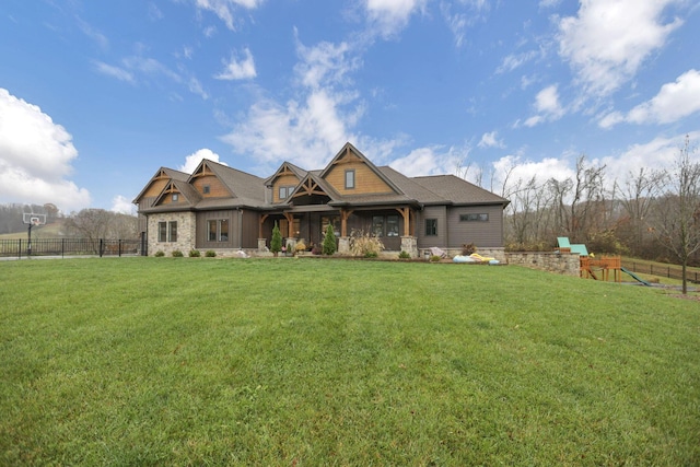 craftsman inspired home with a front lawn