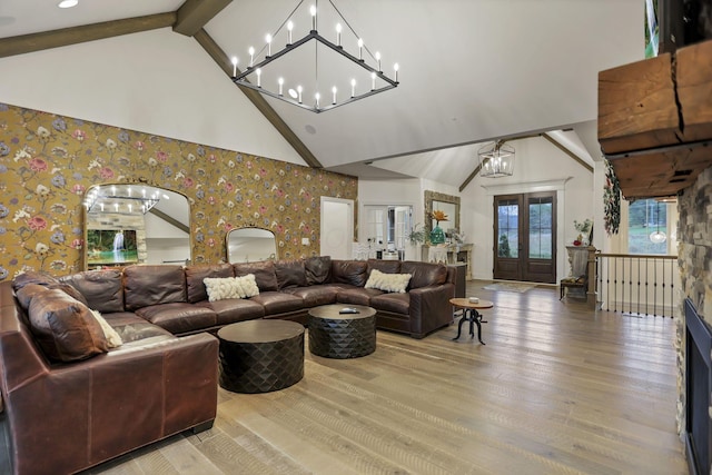 living room with beamed ceiling, french doors, high vaulted ceiling, and hardwood / wood-style floors