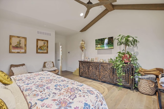 bedroom with light wood-type flooring, lofted ceiling with beams, and ceiling fan