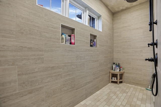 bathroom featuring tiled shower