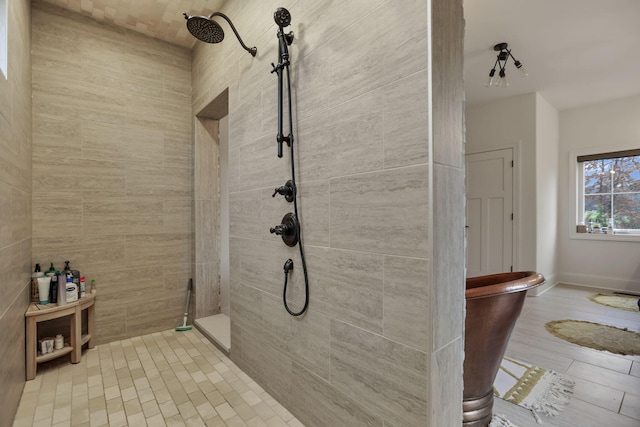 bathroom featuring a tile shower