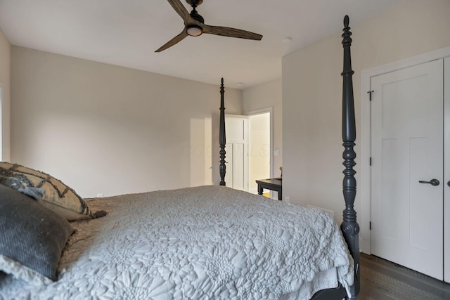 bedroom with dark hardwood / wood-style floors and ceiling fan