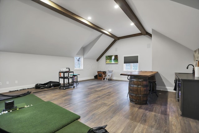 interior space featuring vaulted ceiling with beams, dark hardwood / wood-style flooring, and sink