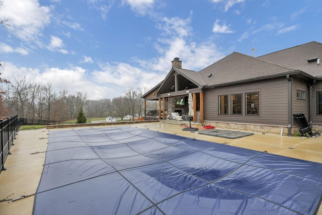 view of swimming pool featuring a patio