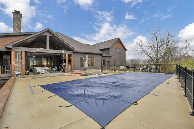 view of swimming pool with a patio