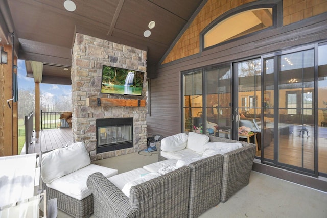 view of patio featuring an outdoor living space with a fireplace