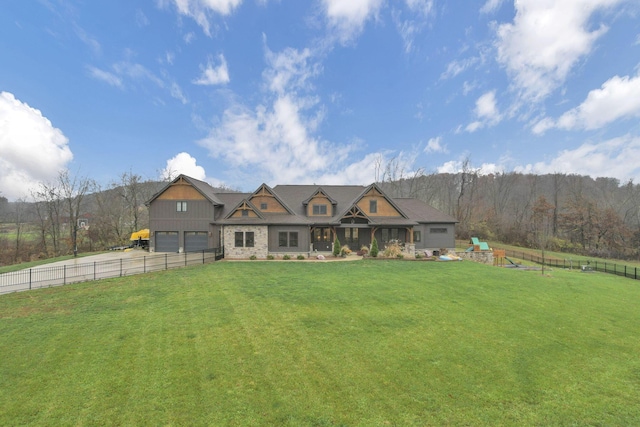 view of front of house featuring a front yard and a garage