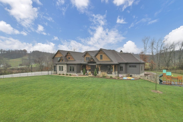 craftsman-style house with a front yard