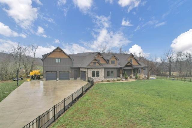 craftsman-style home with a front lawn and a garage