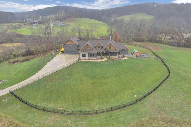 birds eye view of property with a rural view