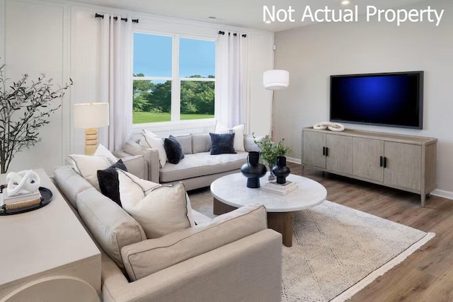 living room with light hardwood / wood-style flooring