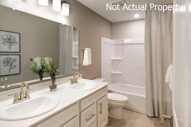 full bathroom featuring tile patterned flooring, shower / bath combination with curtain, toilet, and vanity