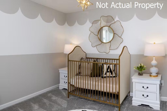 carpeted bedroom with a nursery area