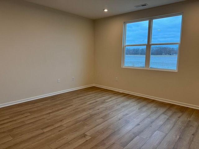 unfurnished room featuring light hardwood / wood-style flooring