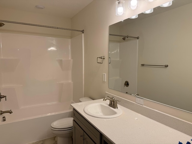 full bathroom featuring vanity, washtub / shower combination, and toilet