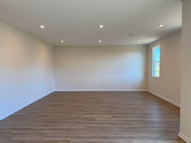 spare room featuring light wood-type flooring