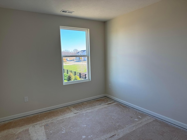 spare room featuring a textured ceiling