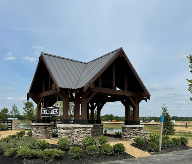 view of community featuring a gazebo and a water view