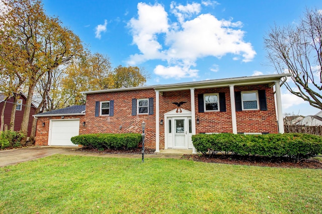 view of front of home with a front lawn and a garage