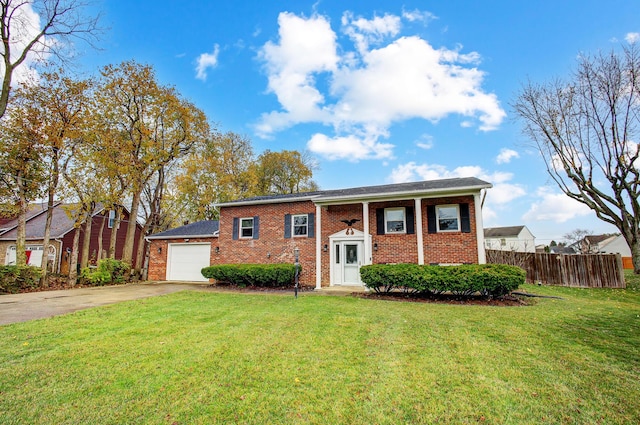 view of front of home featuring a front yard and a garage