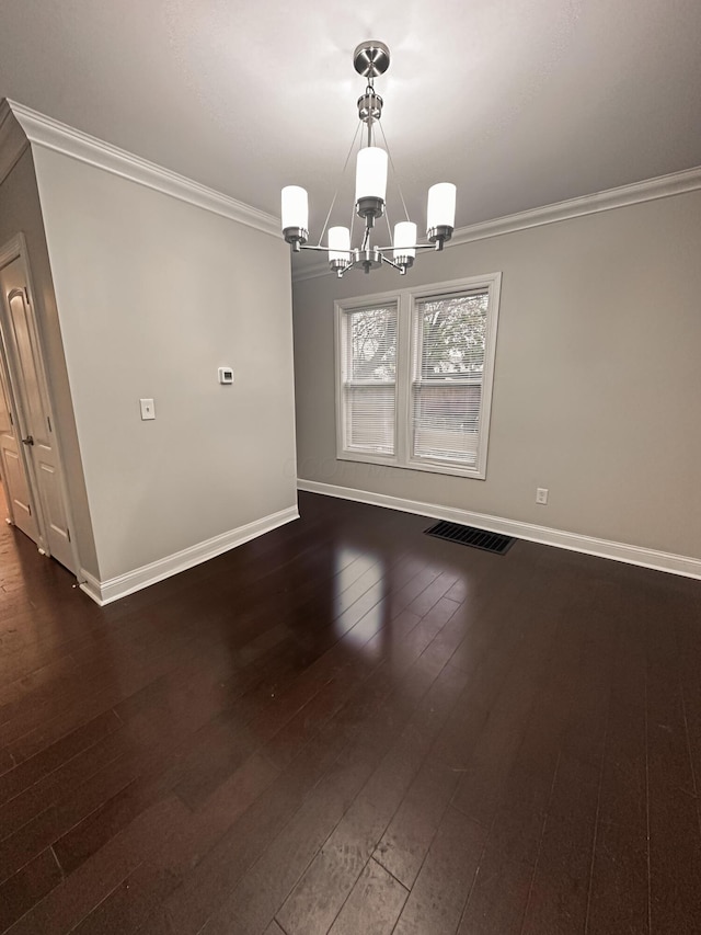 unfurnished dining area featuring a chandelier, dark hardwood / wood-style flooring, and crown molding