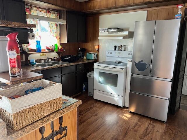 kitchen with sink, dark hardwood / wood-style flooring, white range with electric stovetop, stainless steel fridge, and exhaust hood