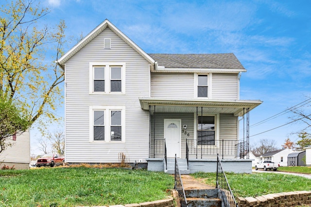 view of front property with a porch and a front yard