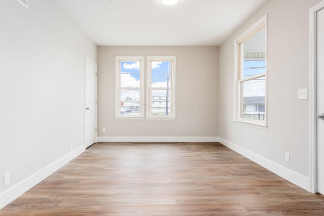 unfurnished room featuring light hardwood / wood-style flooring