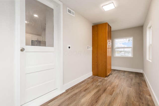 unfurnished room featuring light hardwood / wood-style floors