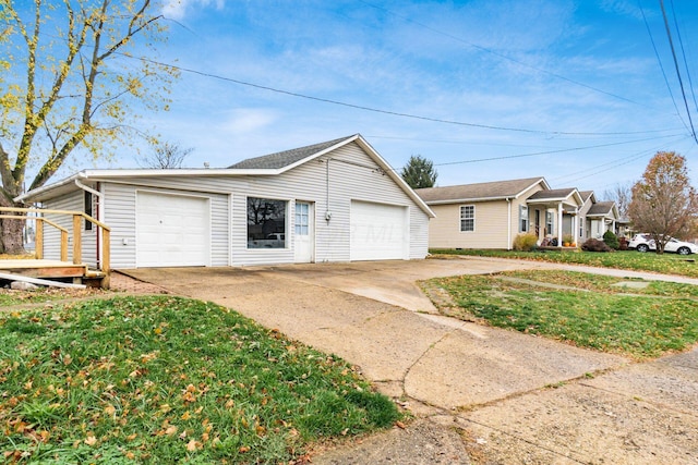 ranch-style home with a front yard and a garage