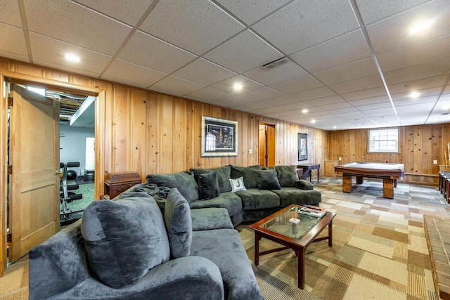 living room featuring a paneled ceiling, wooden walls, and billiards